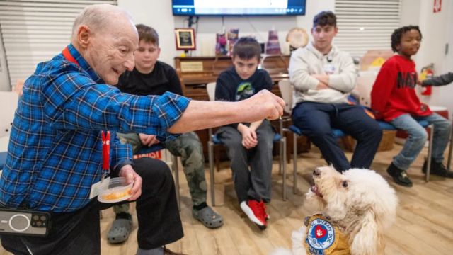 Long Island Retirees, Along with Their Dog, Dedicate Time to Serving Nassau Children